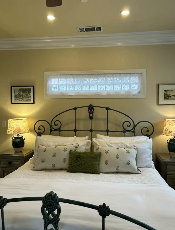 Master bedroom with crisp linens cleaned by Sage Cleanings